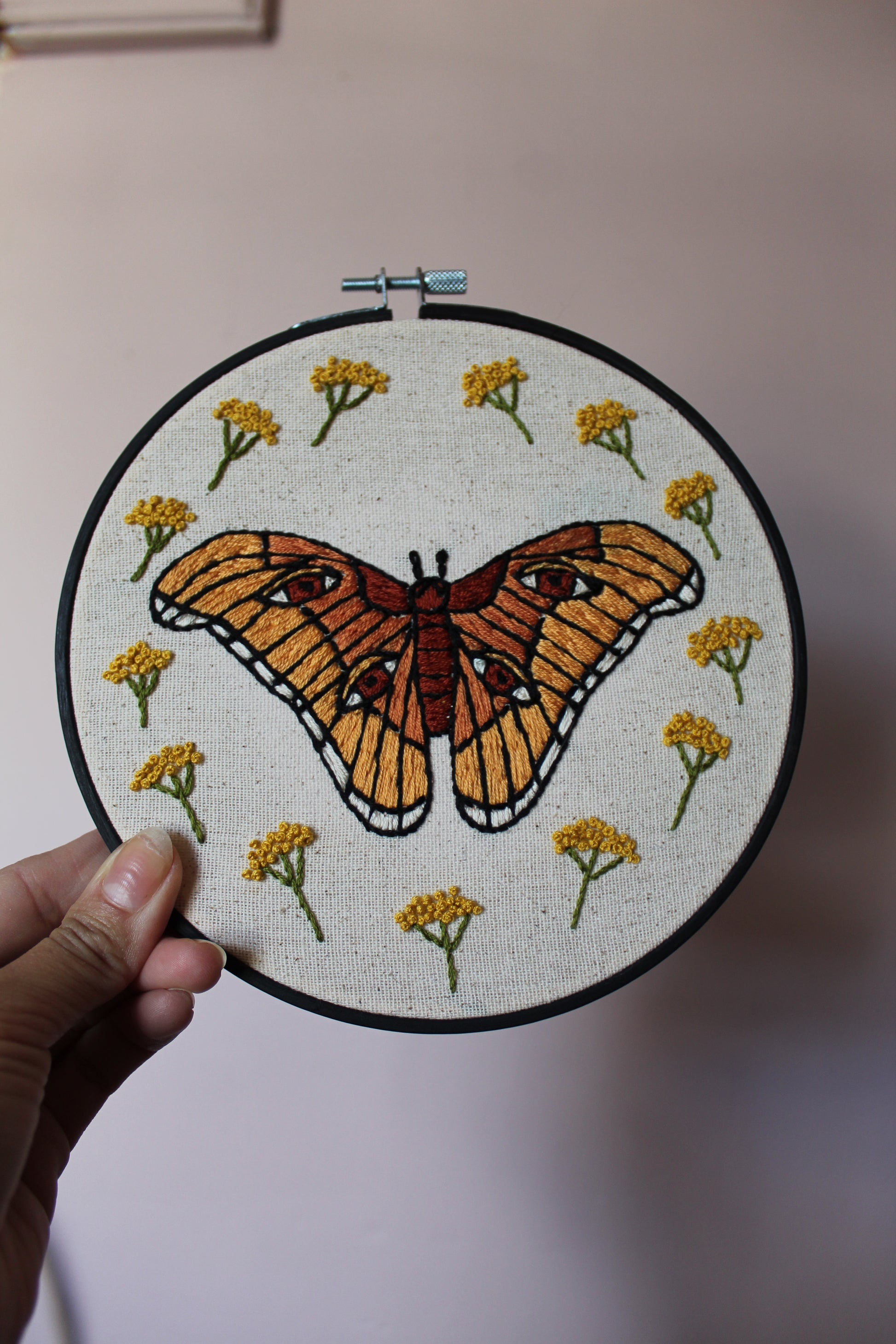 atlas moth embroidery, front held up hoop art