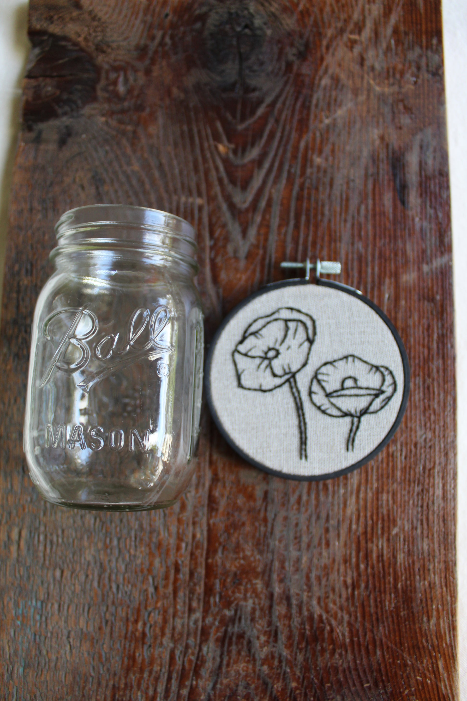 Poppies embroidery, jar for scale, front hoop art