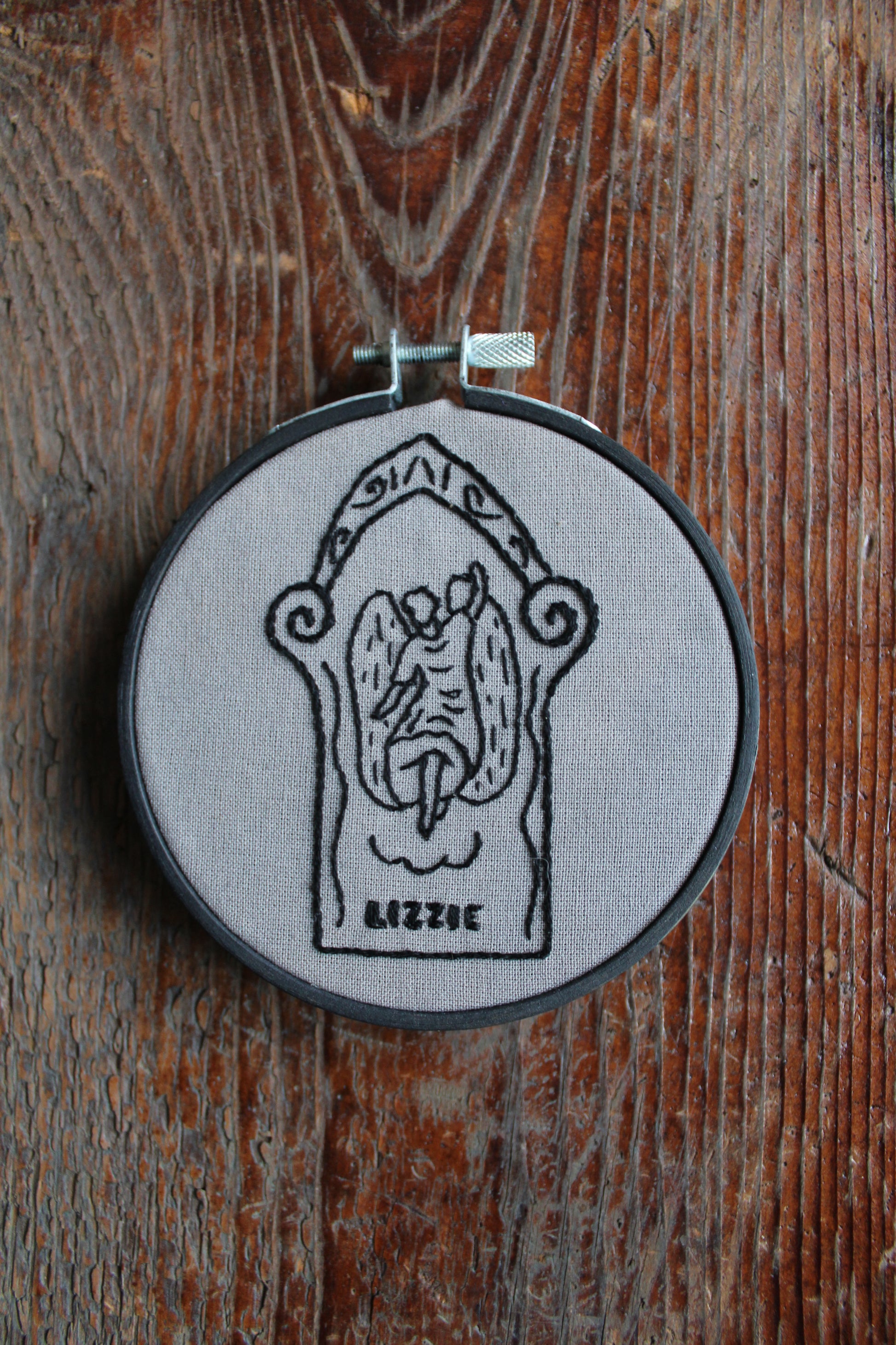 Gravestone embroidery, held hoop art