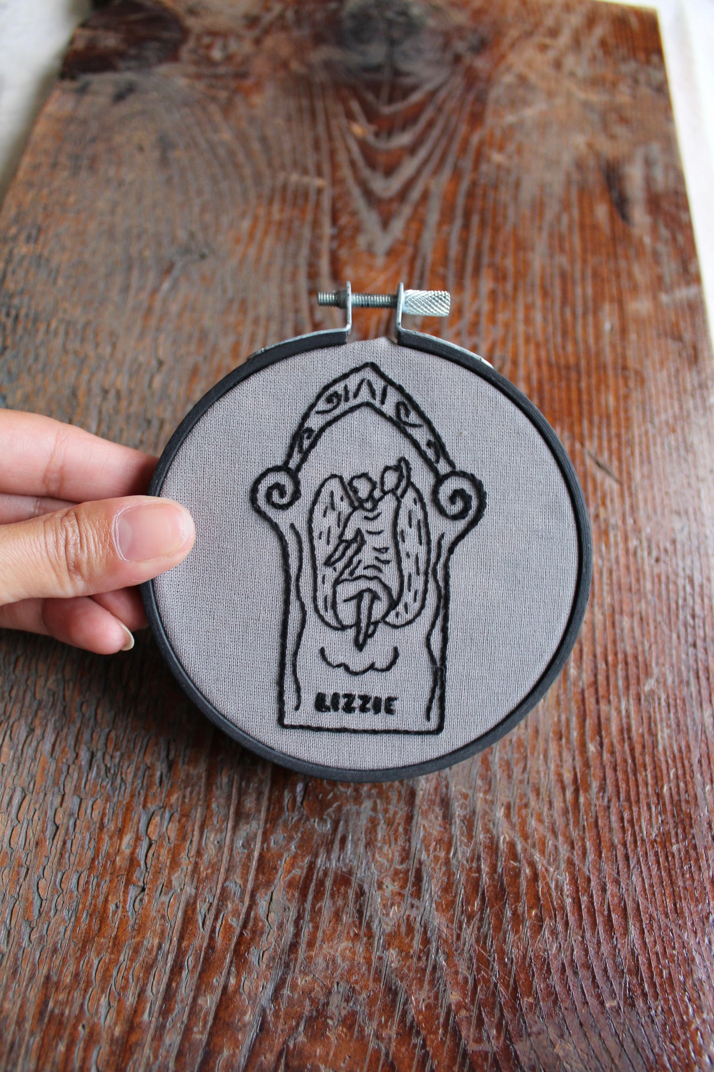 Gravestone embroidery, held hoop art