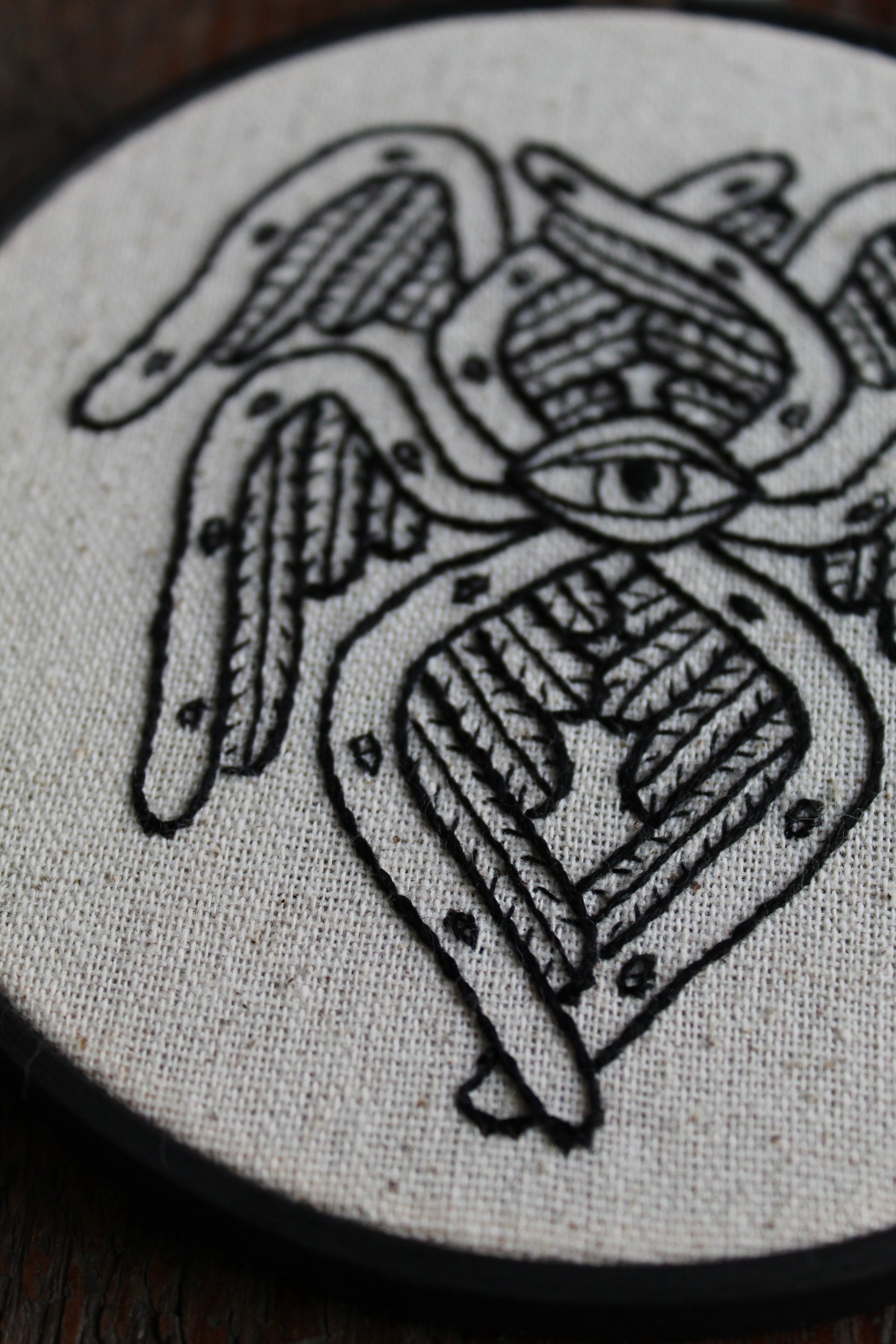 Biblical angel embroidery, close up angled hoop art